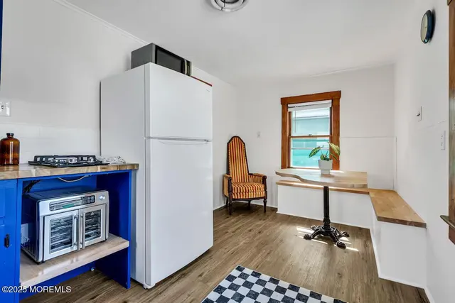 a view of a room that has a bed and a window