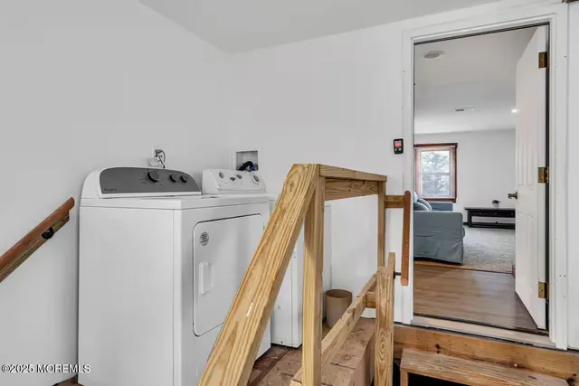 a bedroom with furniture and white walls