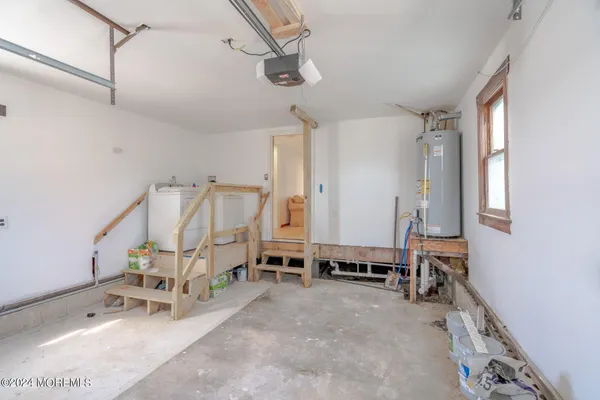 a view of a patio with table and chairs potted plants