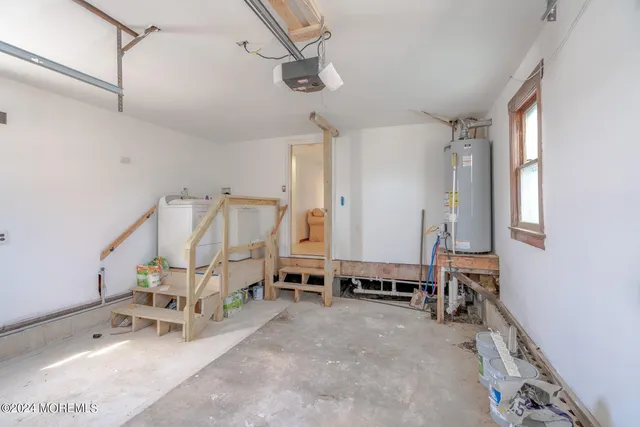 a view of a patio with table and chairs potted plants