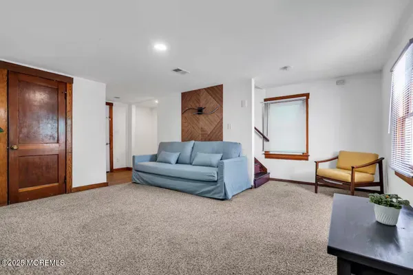 a bedroom with a large bed and a large window