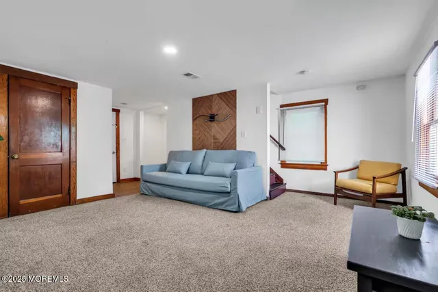 a bedroom with a large bed and a large window