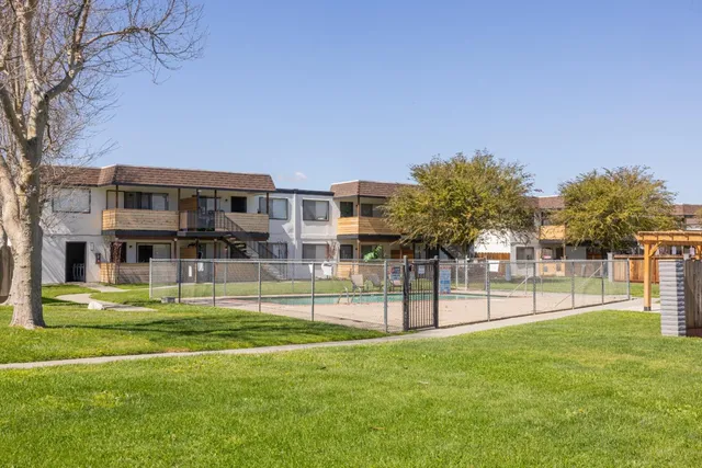 a view of house with outdoor space and garden