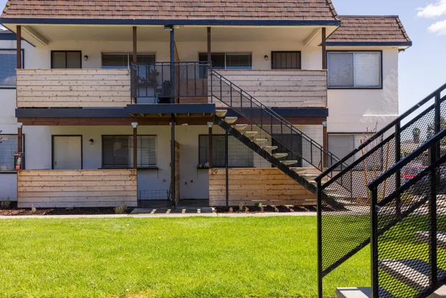 a view of front of house with a yard