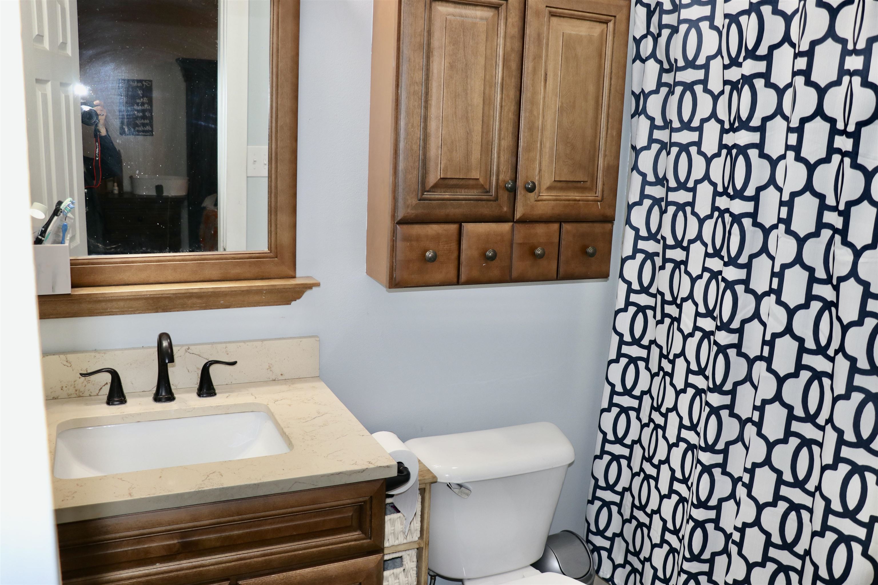 235 Tate Road Dyersburg, TN 38024 - Photo 12 of 28 a bathroom with a sink and a toilet
