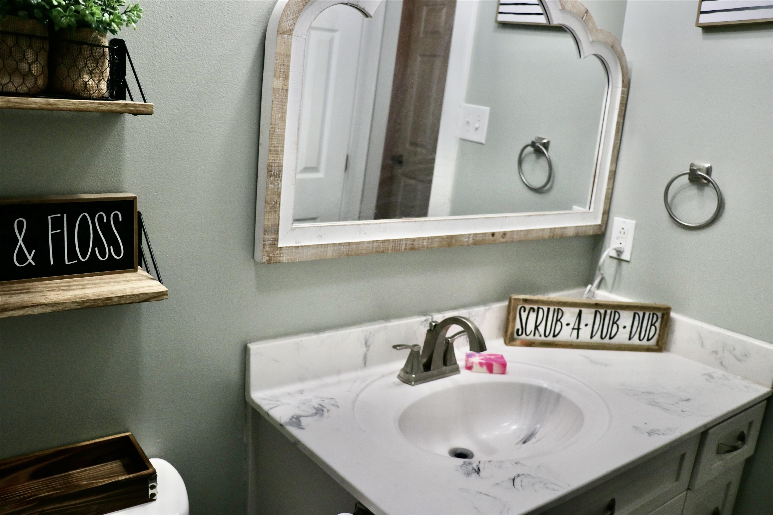 235 Tate Road Dyersburg, TN 38024 - Photo 16 of 28 a bathroom with a sink and a mirror