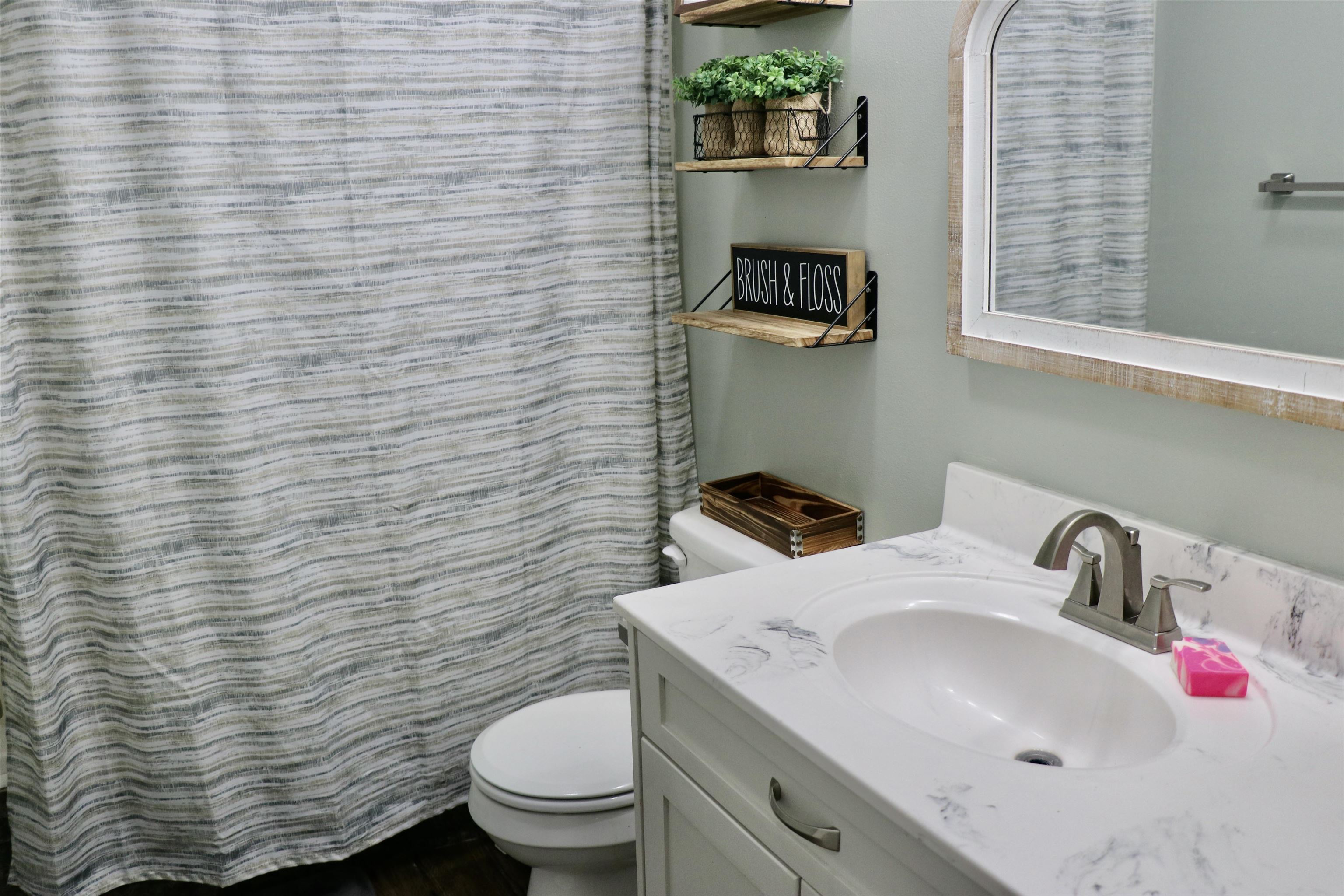 235 Tate Road Dyersburg, TN 38024 - Photo 17 of 28 a bathroom with a sink and a toilet