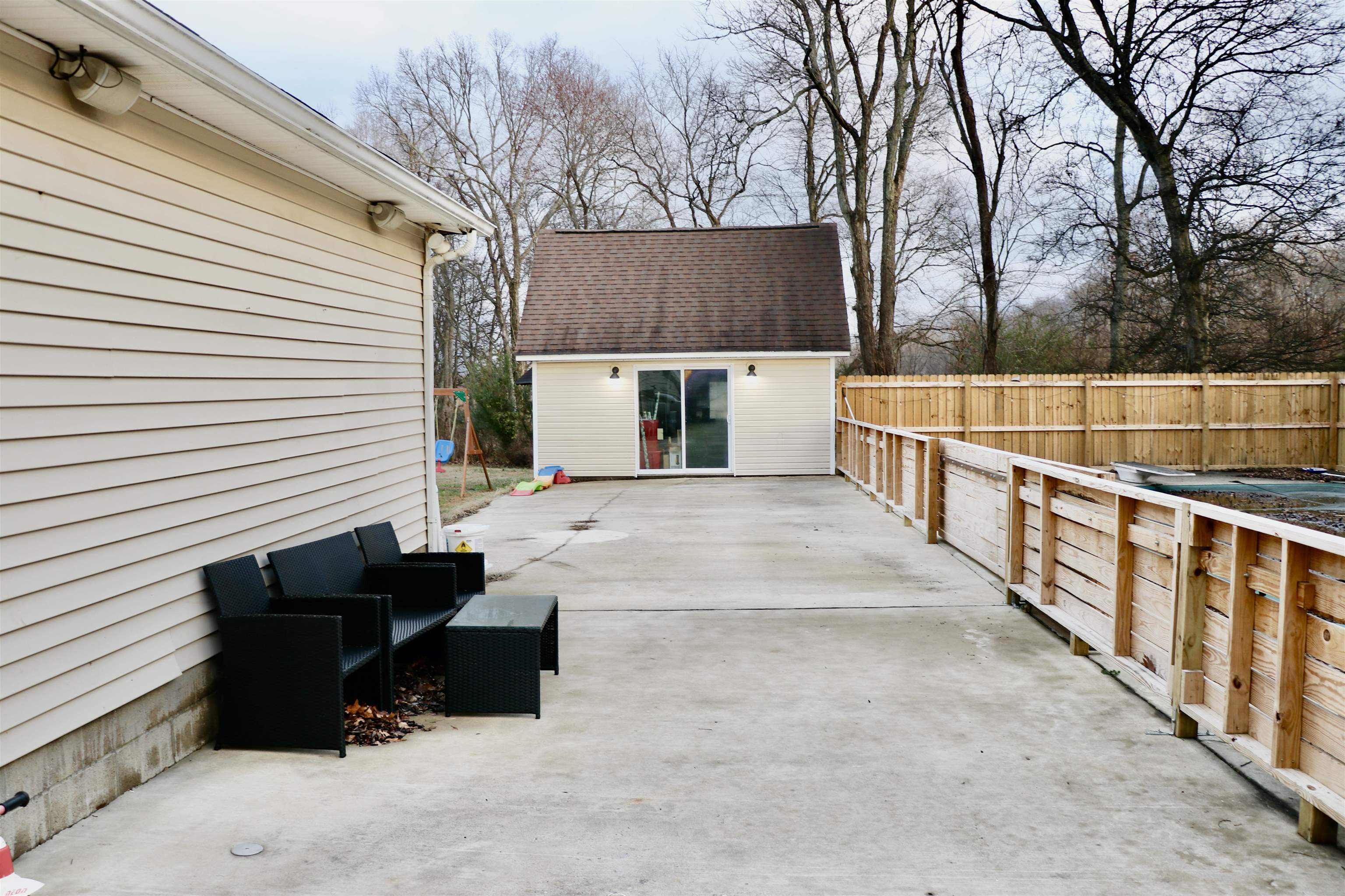 235 Tate Road Dyersburg, TN 38024 - Photo 23 of 28 a view of a terrace with a bench