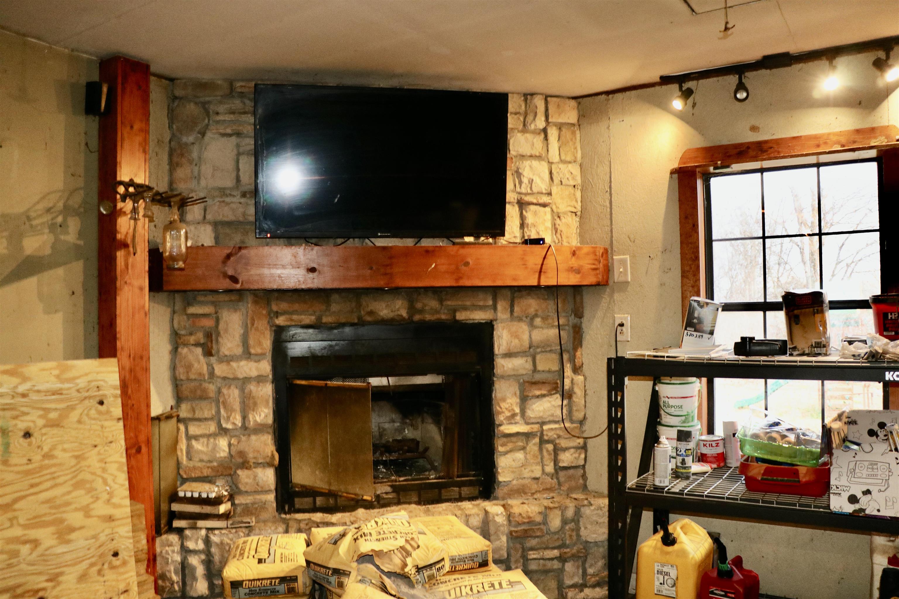 235 Tate Road Dyersburg, TN 38024 - Photo 26 of 28 a living room with fireplace and a flat screen tv