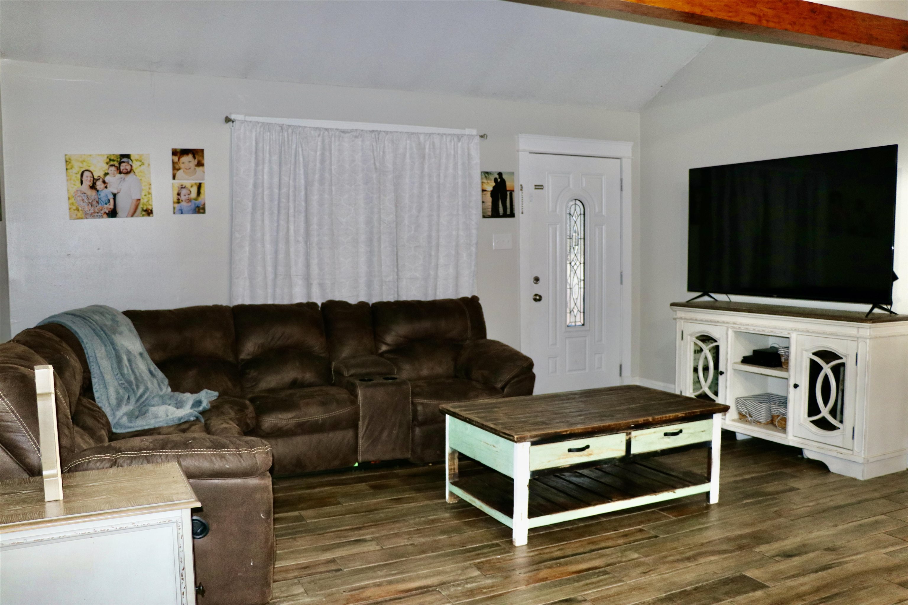 235 Tate Road Dyersburg, TN 38024 - Photo 10 of 28 a living room with furniture and a flat screen tv
