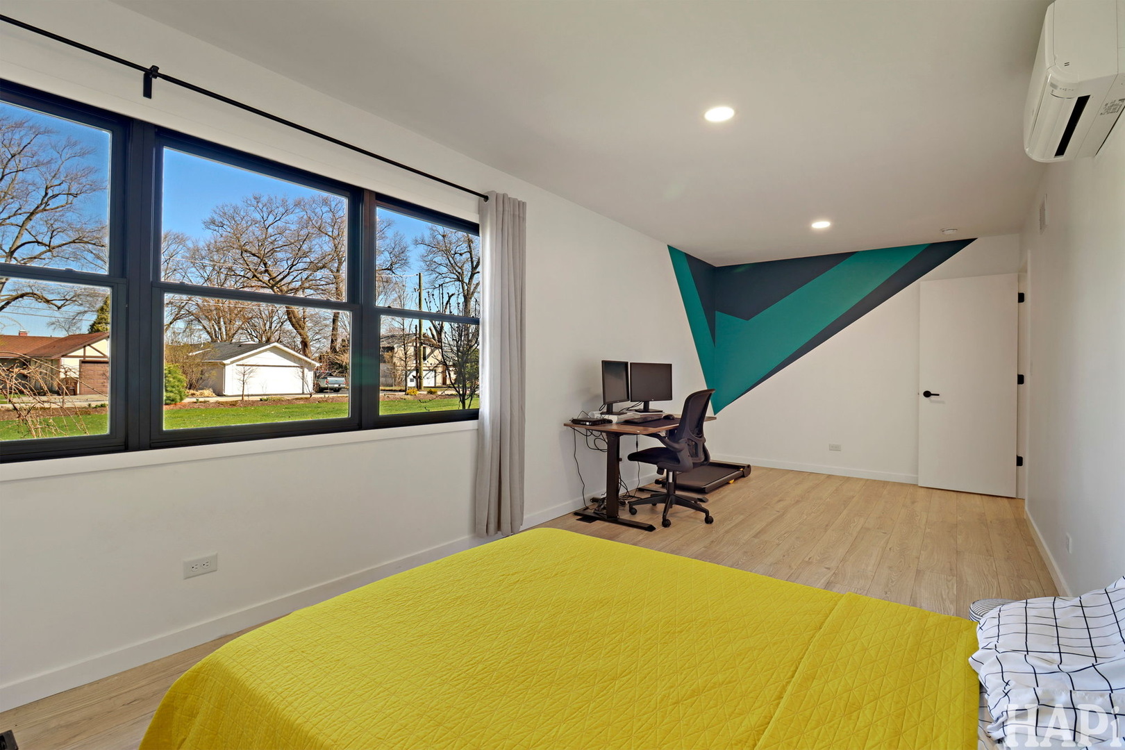 4321 West Lakewood Road McHenry, IL 60050 - Photo 27 of 51 a bedroom with a bed and a large window