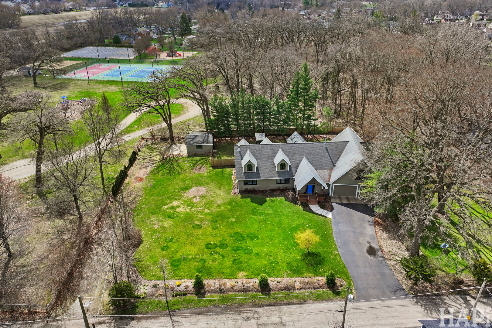 4321 West Lakewood Road McHenry, IL 60050 - Photo 41 of 51 an aerial view of a house with a garden and swimming pool