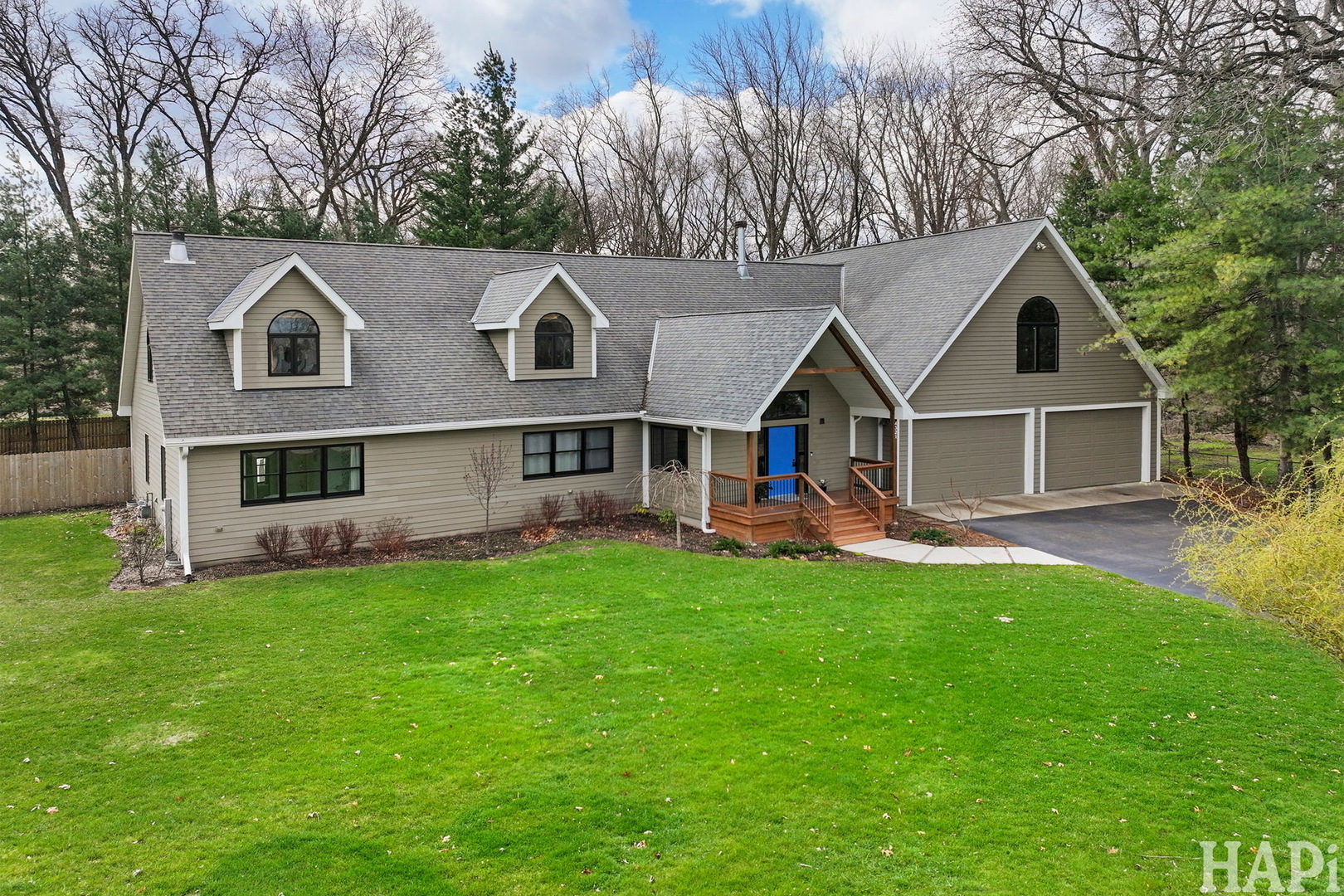 4321 West Lakewood Road McHenry, IL 60050 - Photo 48 of 51 a view of a house with a big yard potted plants and large tree