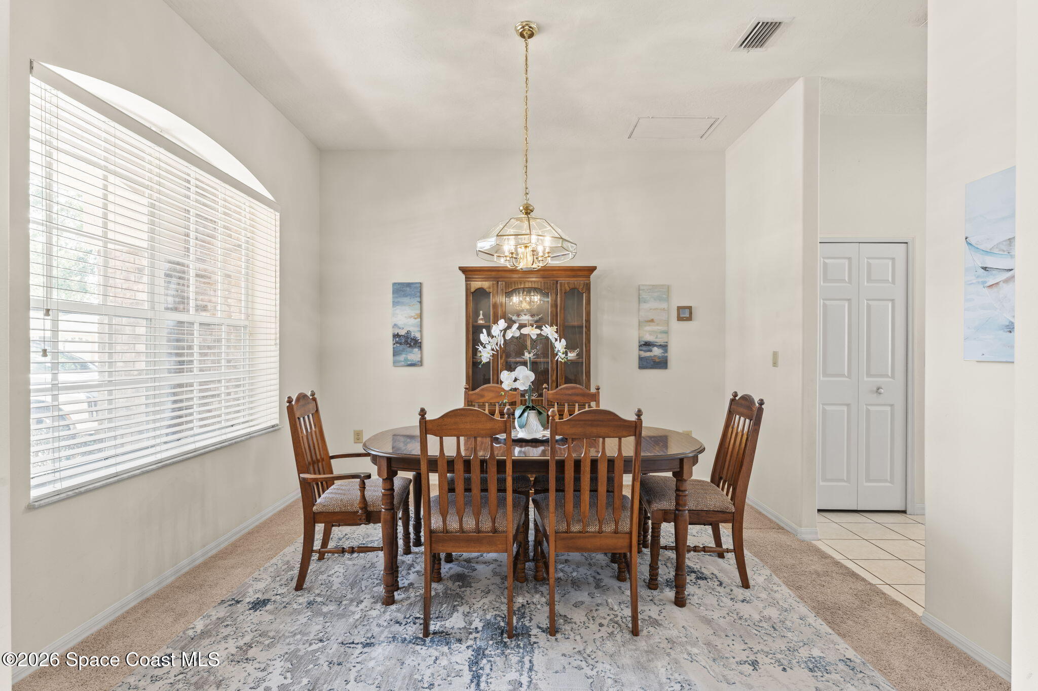 1123 Spring Oak Drive Melbourne, FL 32901 - Photo 13 of 67 a view of a dining room with furniture window and outside view