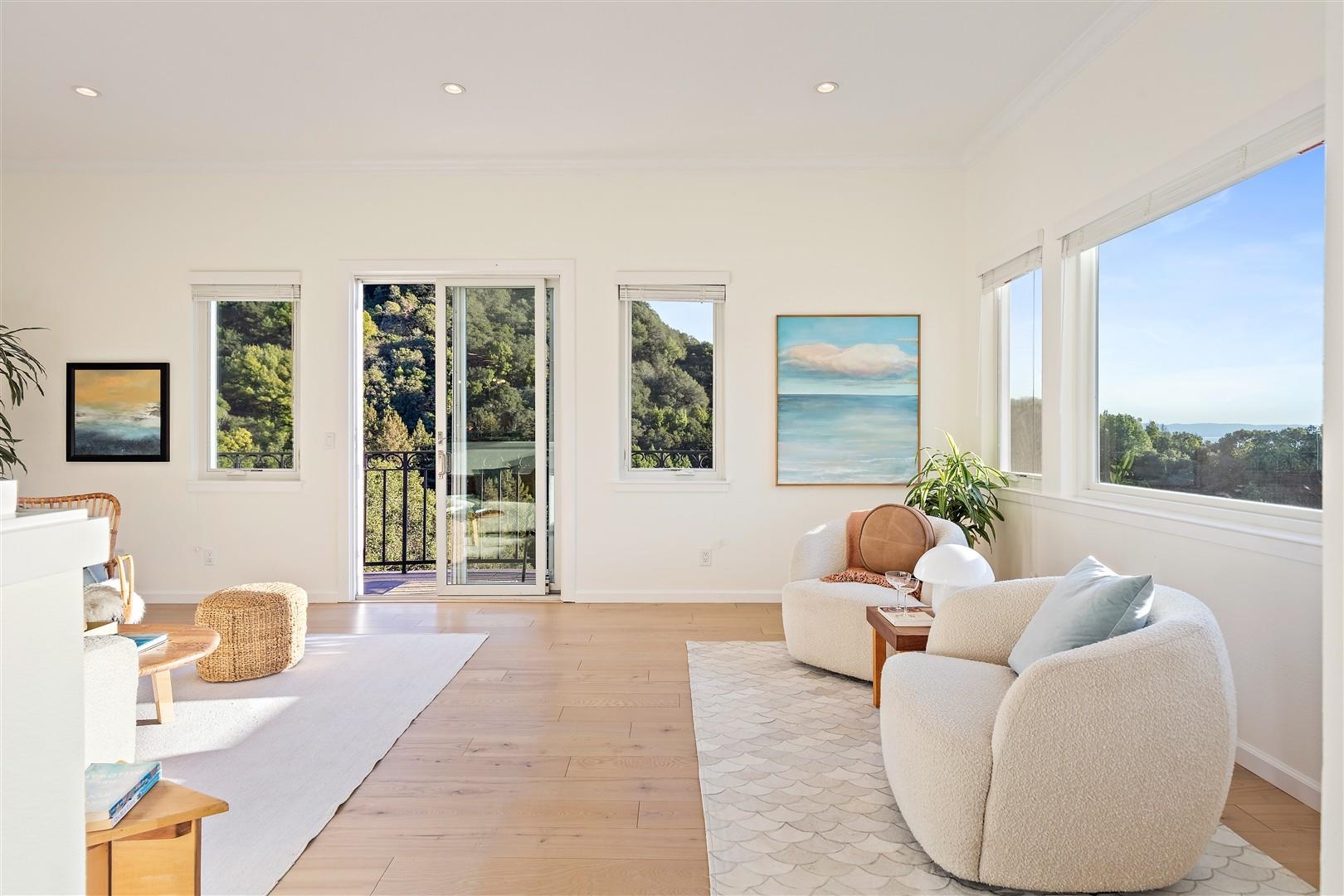 4630 Redwood Road Oakland, CA 94619 - Photo 11 of 58 a living room with furniture and large windows