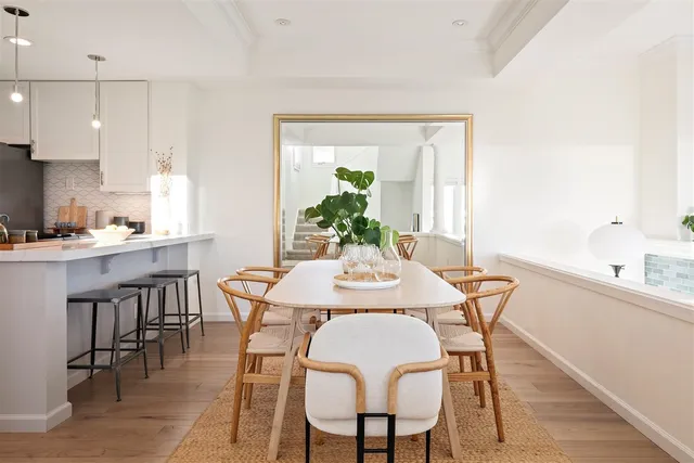 a kitchen with a table and chairs in it
