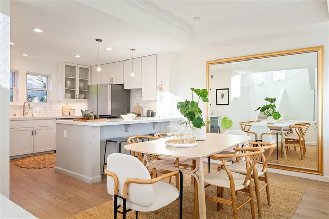 a kitchen with a stove a sink and a refrigerator