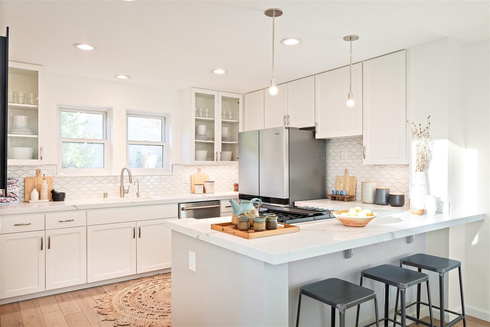 4630 Redwood Road Oakland, CA 94619 - Photo 26 of 58 a kitchen with a sink a stove a refrigerator and cabinets