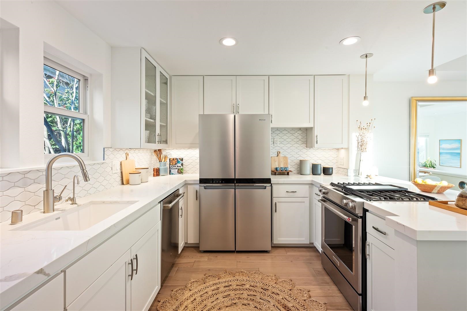 4630 Redwood Road Oakland, CA 94619 - Photo 28 of 58 a kitchen with a stove a sink and a refrigerator