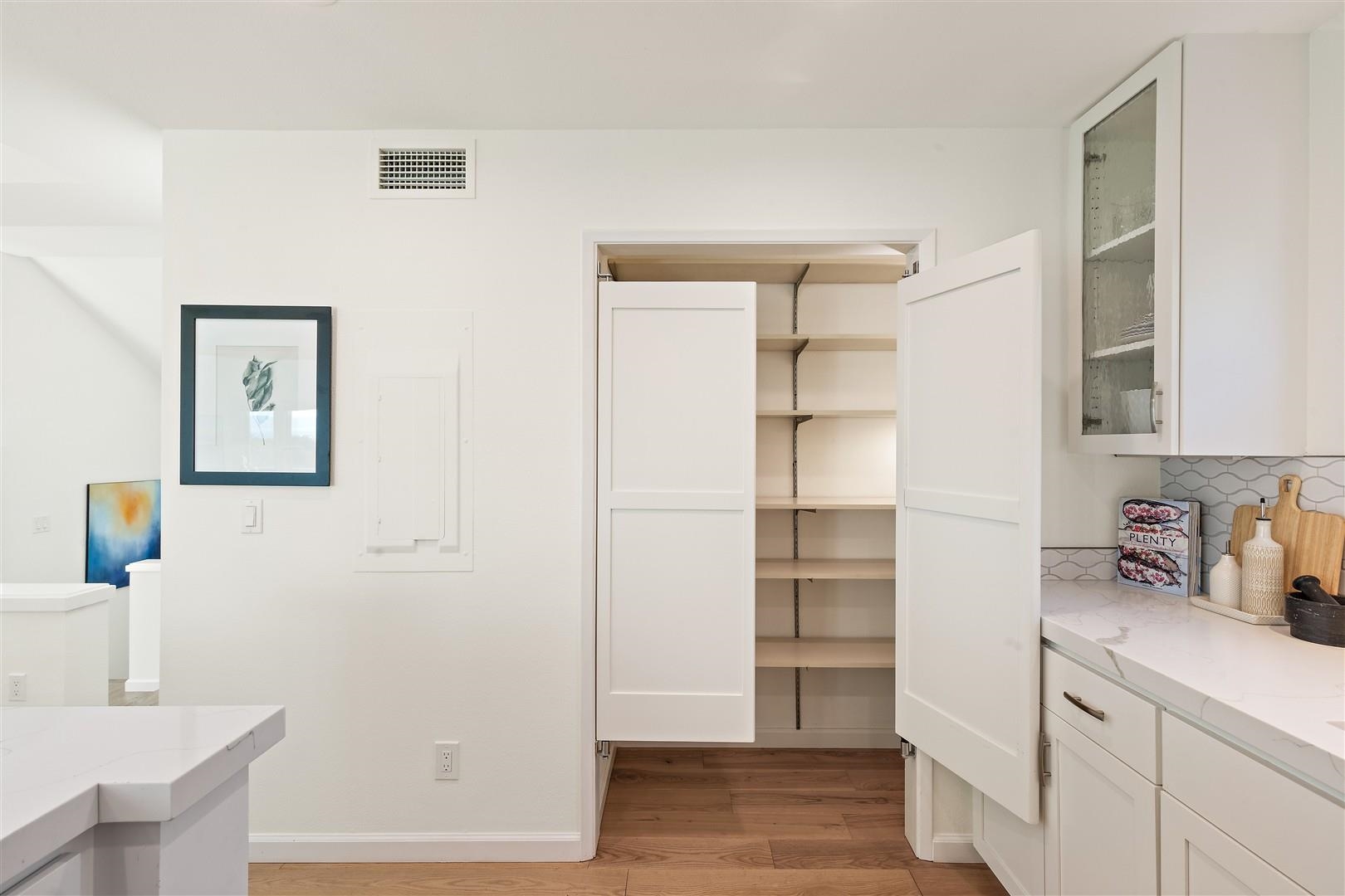 4630 Redwood Road Oakland, CA 94619 - Photo 30 of 58 a kitchen with a refrigerator and cabinets