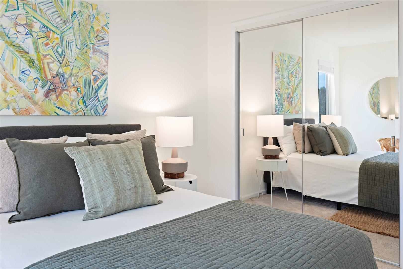 4630 Redwood Road Oakland, CA 94619 - Photo 37 of 58 a bedroom with a bed and lamp