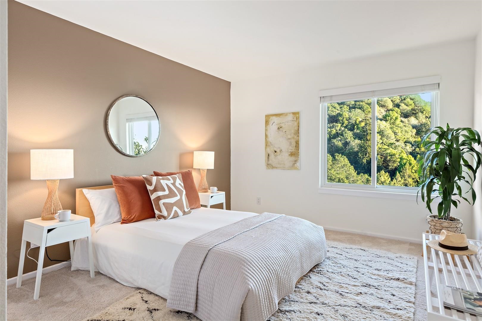 4630 Redwood Road Oakland, CA 94619 - Photo 40 of 58 a bedroom with a bed and a painting on the wall