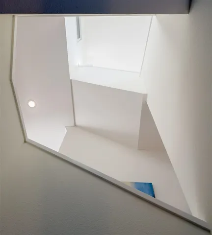 a view of a livingroom with furniture and a window