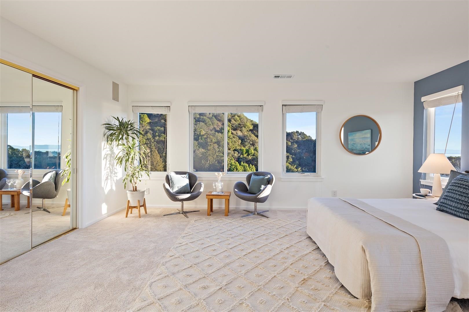 4630 Redwood Road Oakland, CA 94619 - Photo 44 of 58 a bedroom with a large bed and a large window