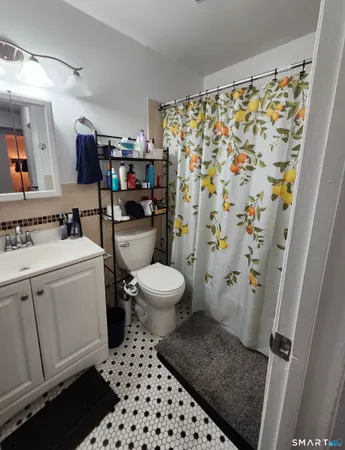 a bedroom with furniture and a chair