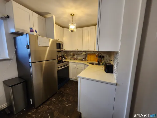 a bathroom with a sink and mirror