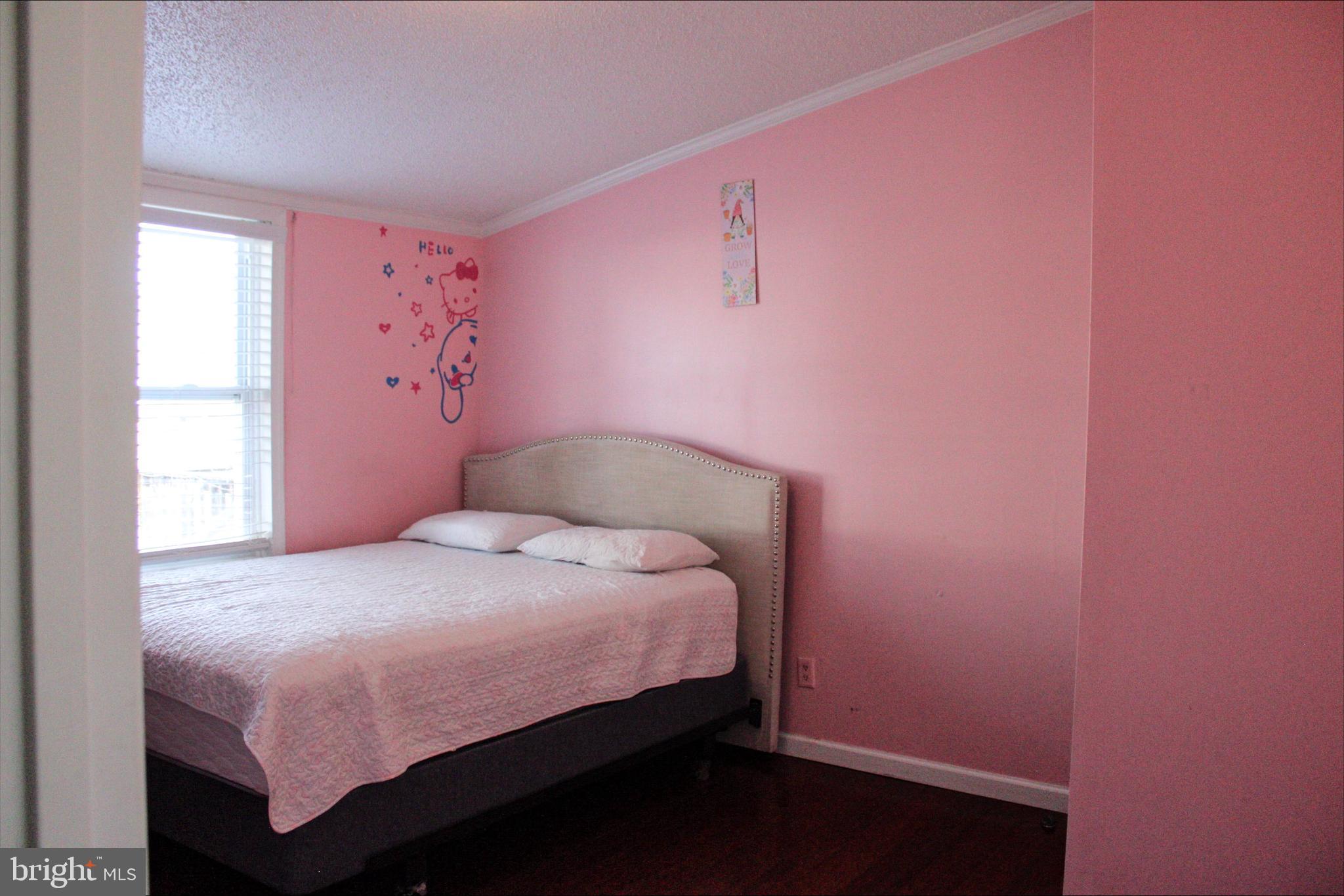 1061 South Little Creek Road, Unit 200 Dover, DE 19901 - Photo 11 of 21 a bedroom with a bed and a window