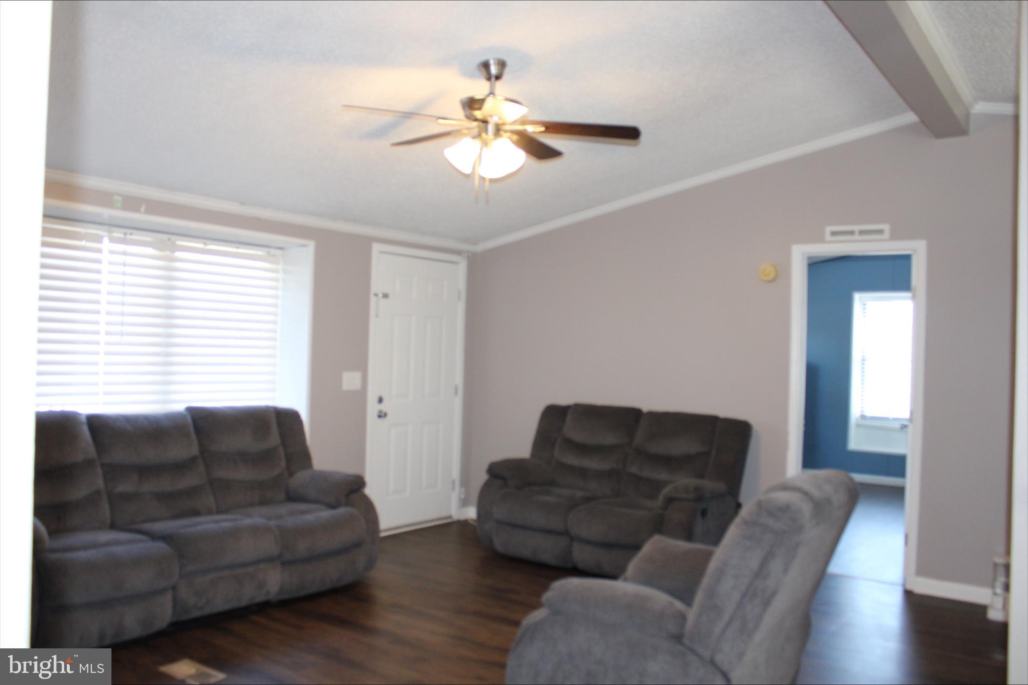 1061 South Little Creek Road, Unit 200 Dover, DE 19901 - Photo 21 of 21 a living room with furniture and a large window