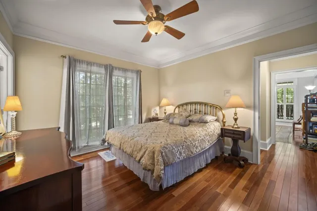 a view of hallway with wooden floor