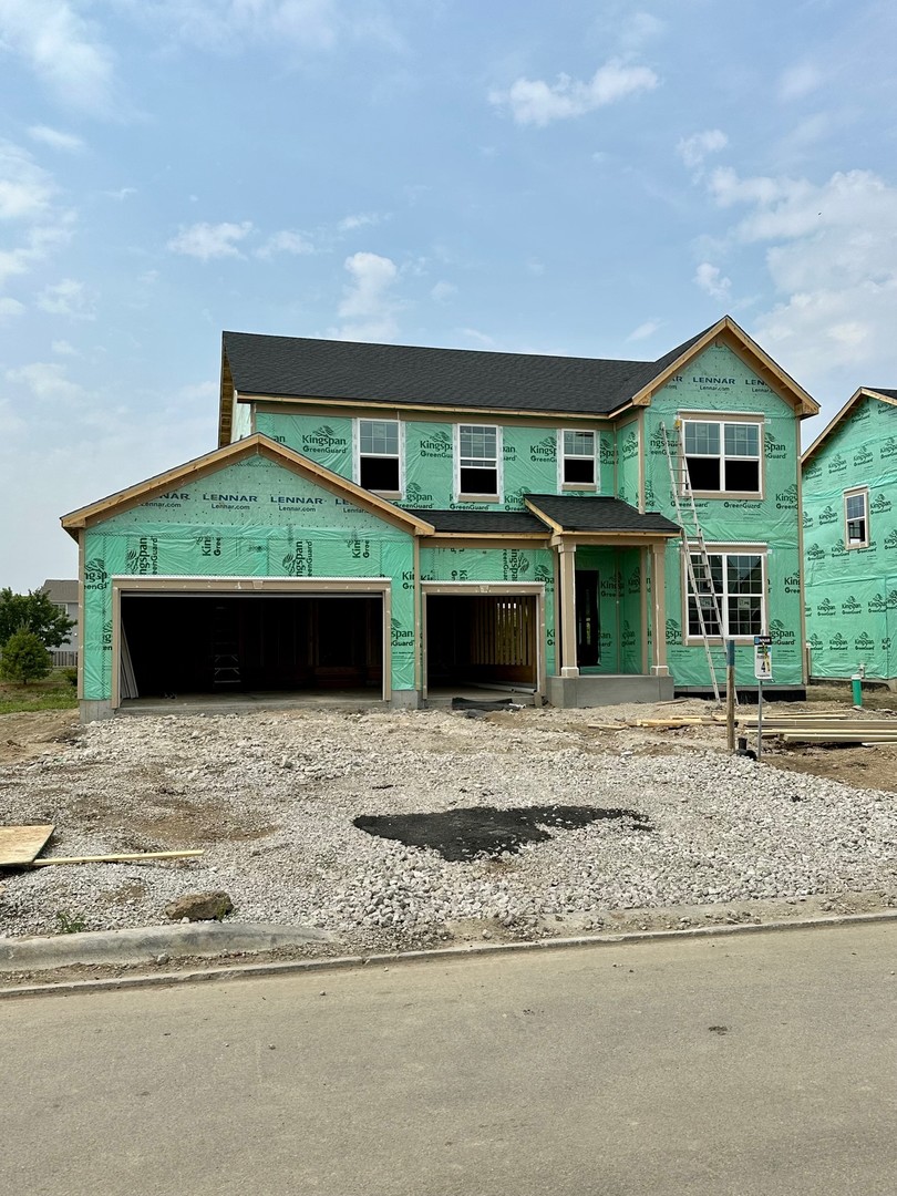 87 Hedgerow Drive Elgin, IL 60124 - Photo 1 of 52 a front view of a house with a yard