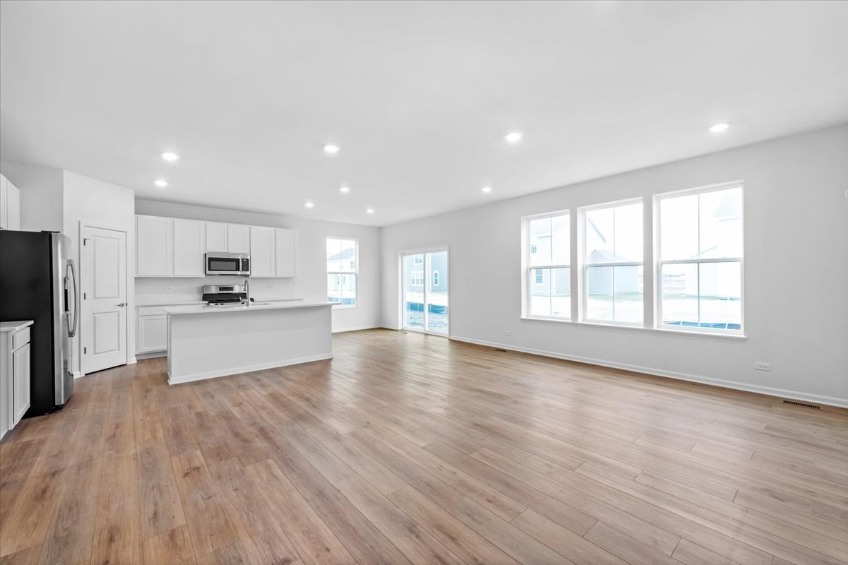 87 Hedgerow Drive Elgin, IL 60124 - Photo 12 of 52 a view of kitchen with cabinets and wooden floor