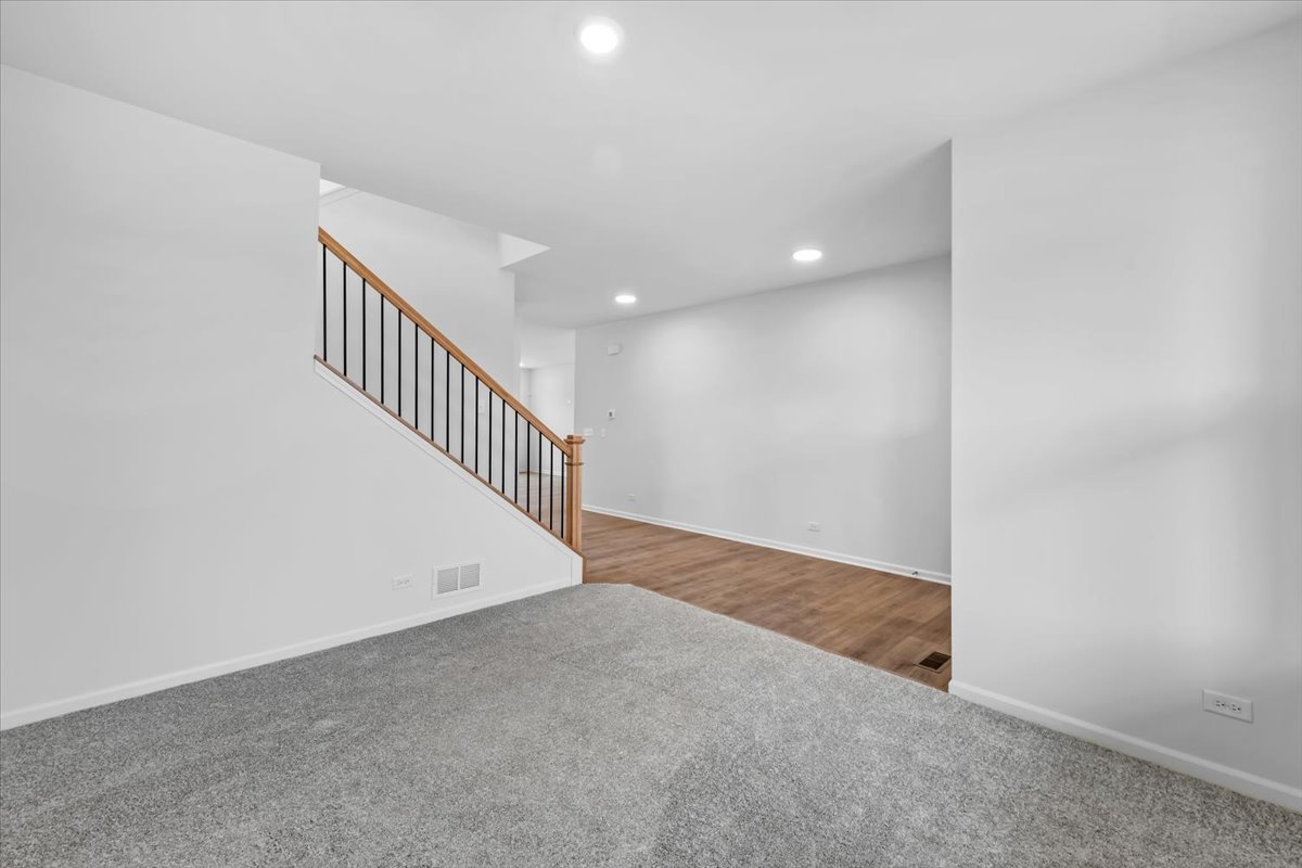 87 Hedgerow Drive Elgin, IL 60124 - Photo 16 of 52 a view of an empty room with stairs