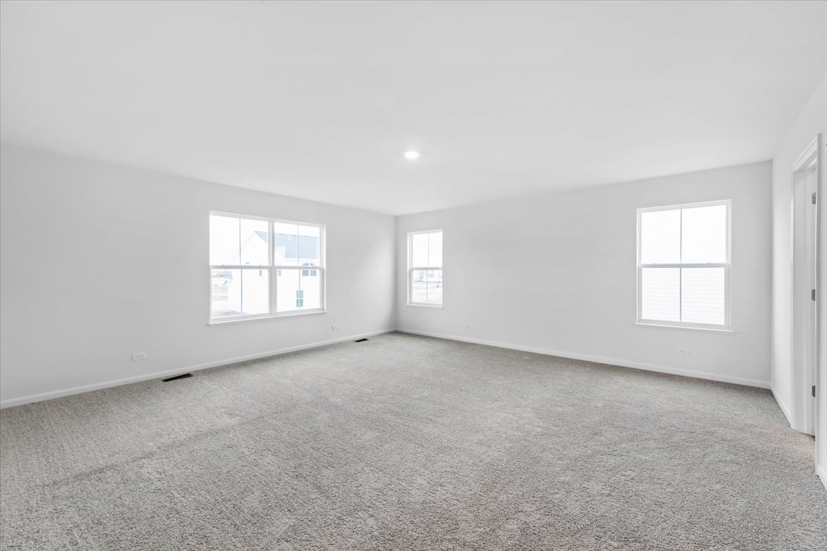 87 Hedgerow Drive Elgin, IL 60124 - Photo 28 of 52 an empty room with windows