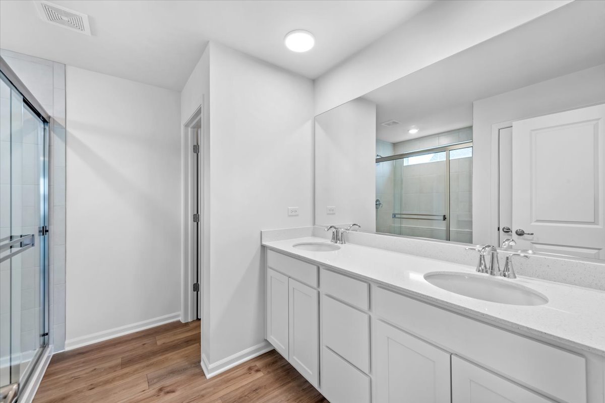 87 Hedgerow Drive Elgin, IL 60124 - Photo 30 of 52 a bathroom with a sink and a mirror