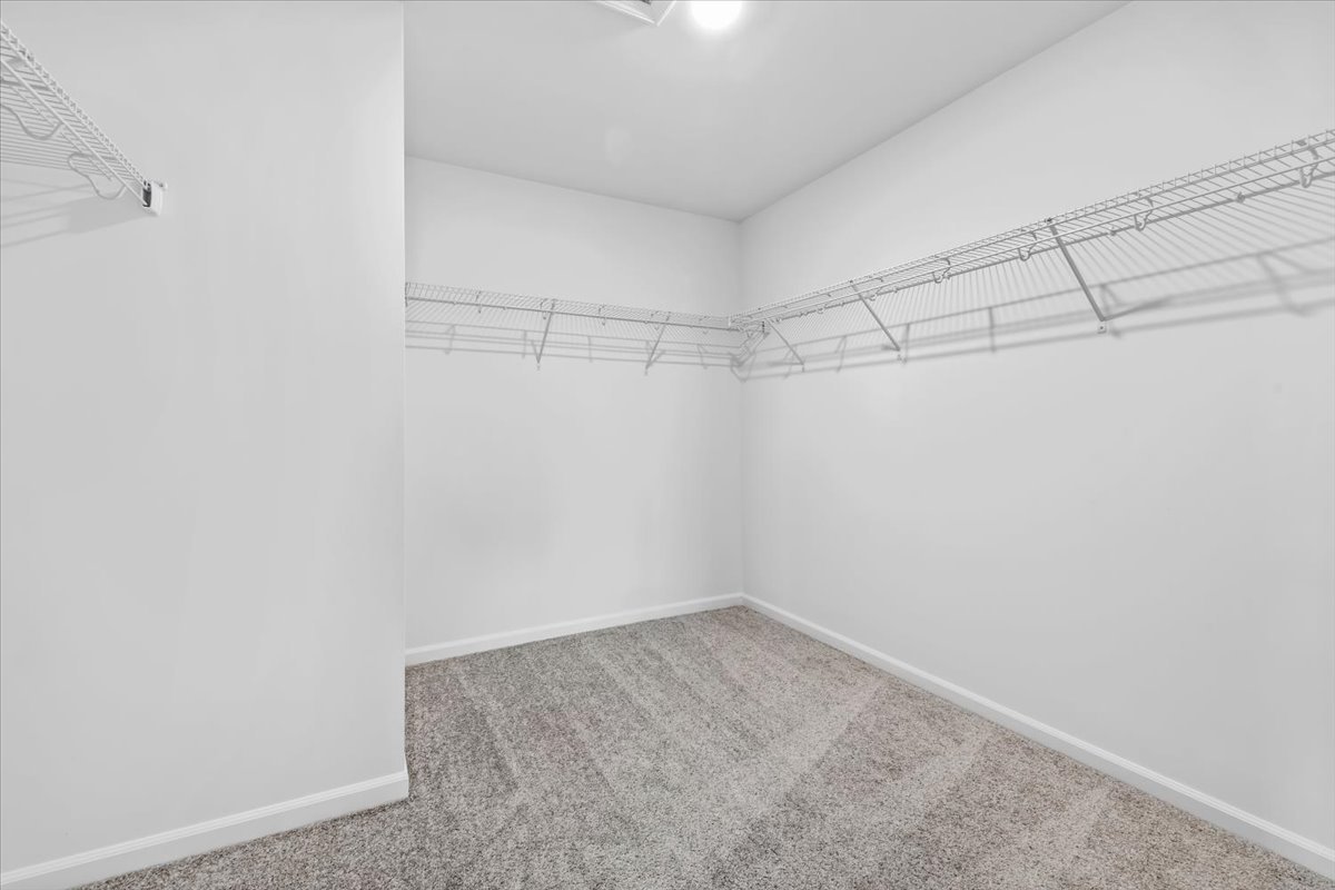 87 Hedgerow Drive Elgin, IL 60124 - Photo 31 of 52 a view of a room with racks on the wall