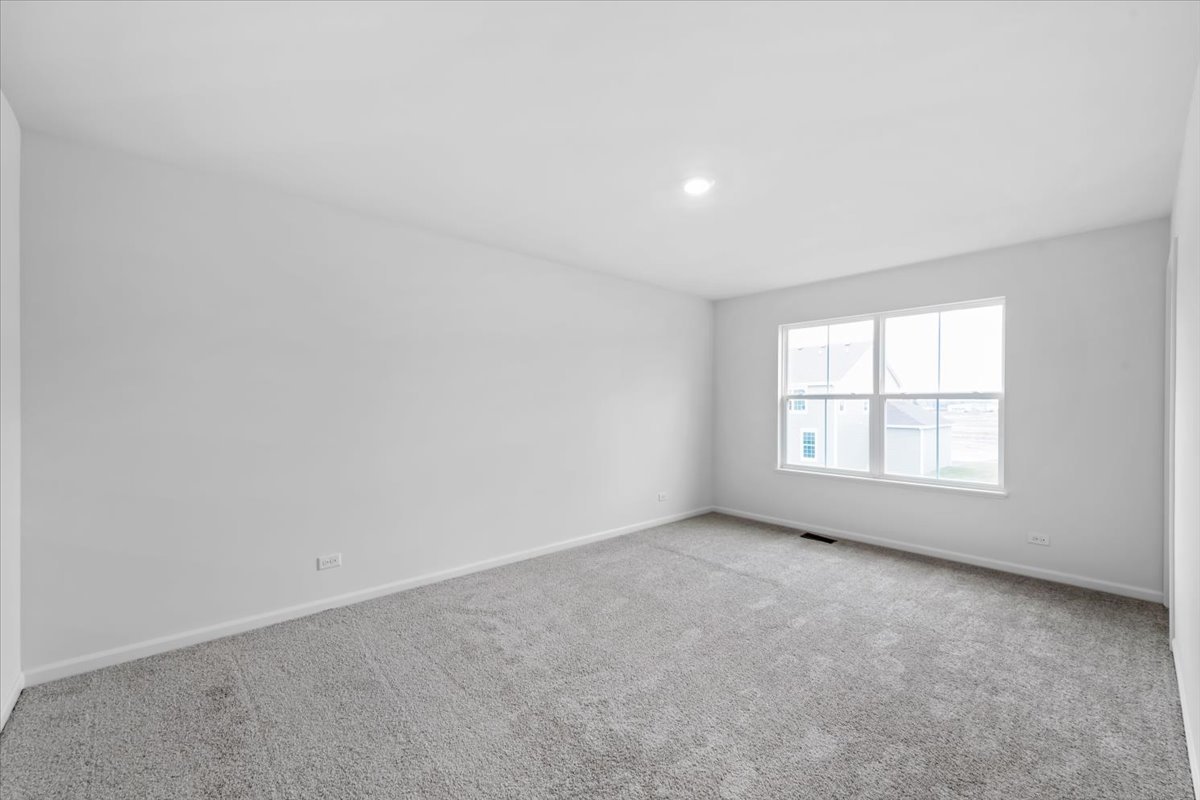 87 Hedgerow Drive Elgin, IL 60124 - Photo 32 of 52 an empty room with a window