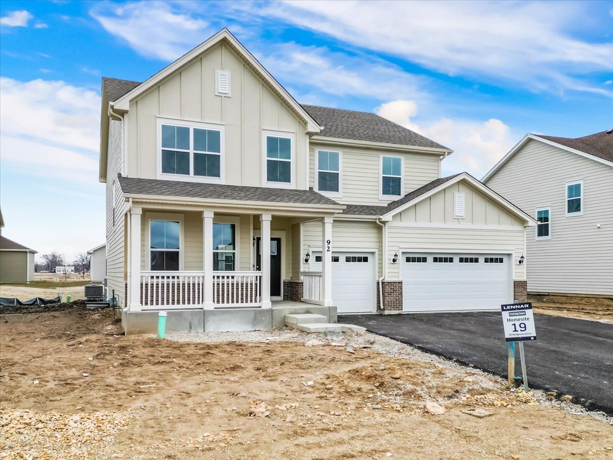 87 Hedgerow Drive Elgin, IL 60124 - Photo 4 of 52 a view of a house with a yard