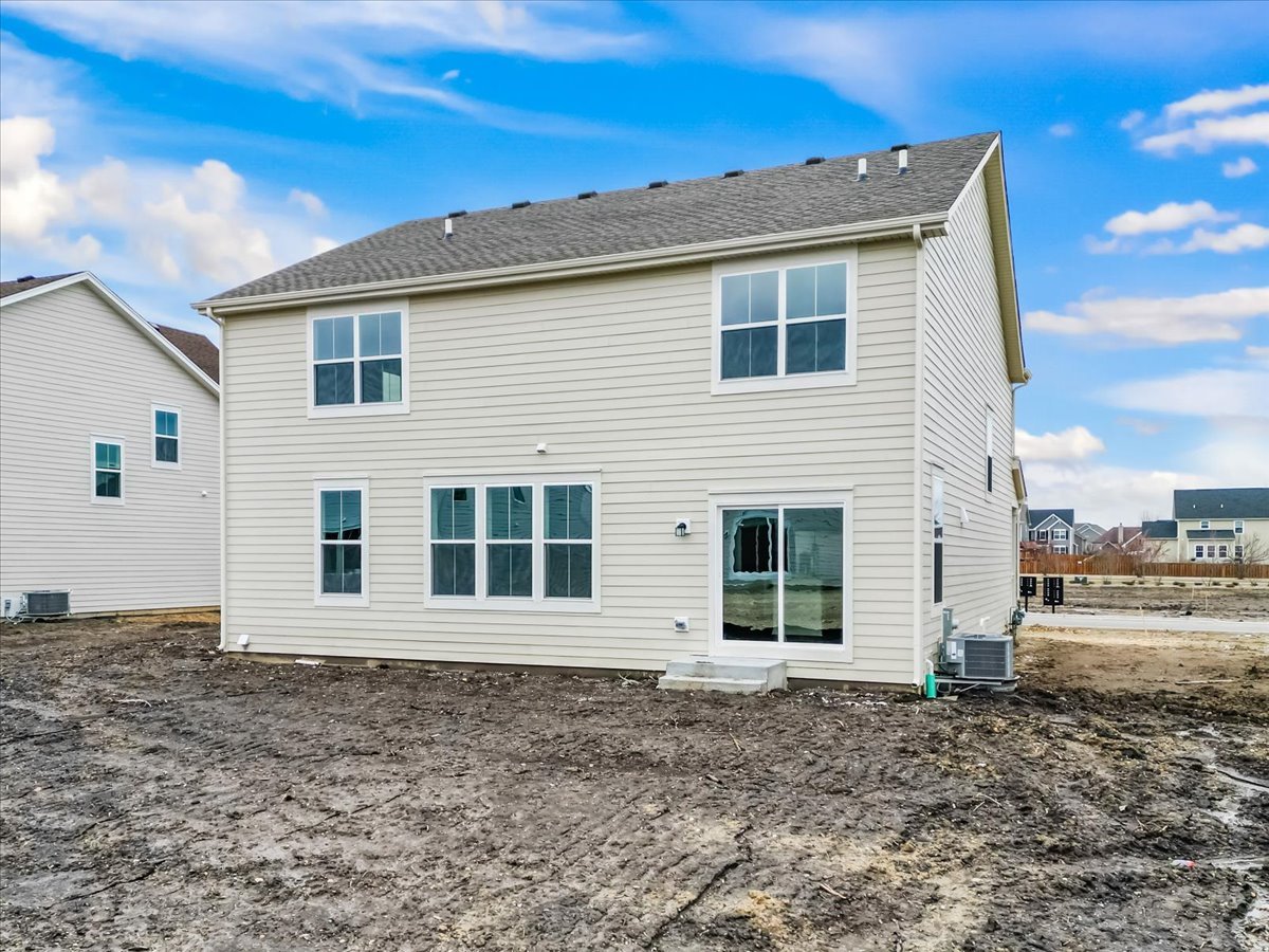 87 Hedgerow Drive Elgin, IL 60124 - Photo 5 of 52 a view of a house with a backyard