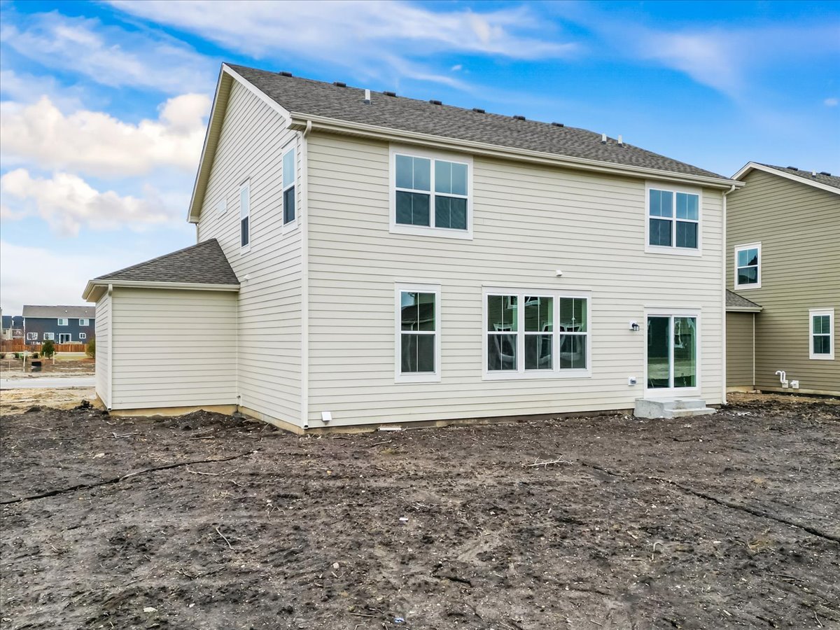 87 Hedgerow Drive Elgin, IL 60124 - Photo 7 of 52 a front view of a house