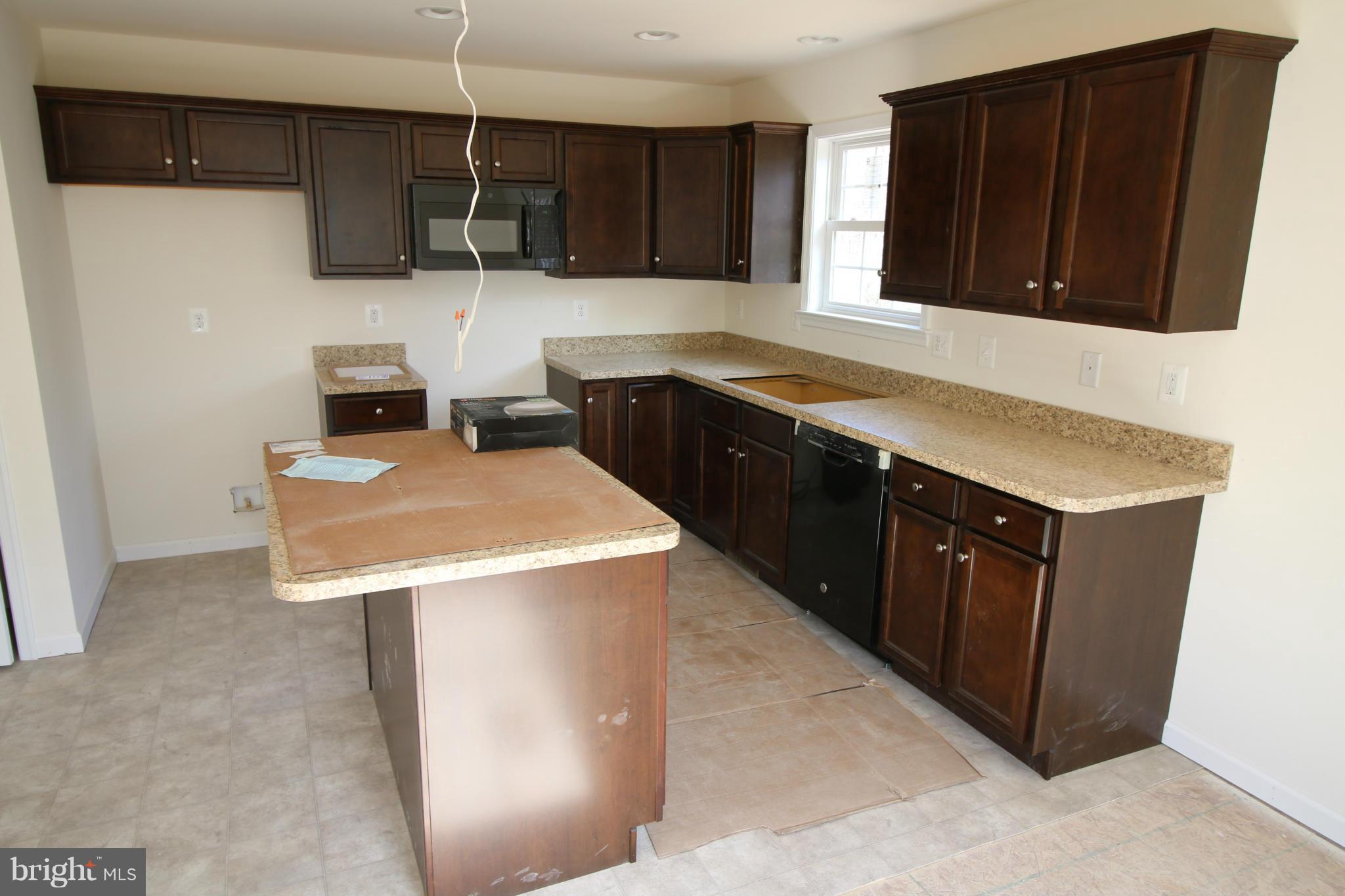 2710 Welltown Road Clear Brook, VA 22624 - Photo 2 of 6 a kitchen with a sink a stove and refrigerator