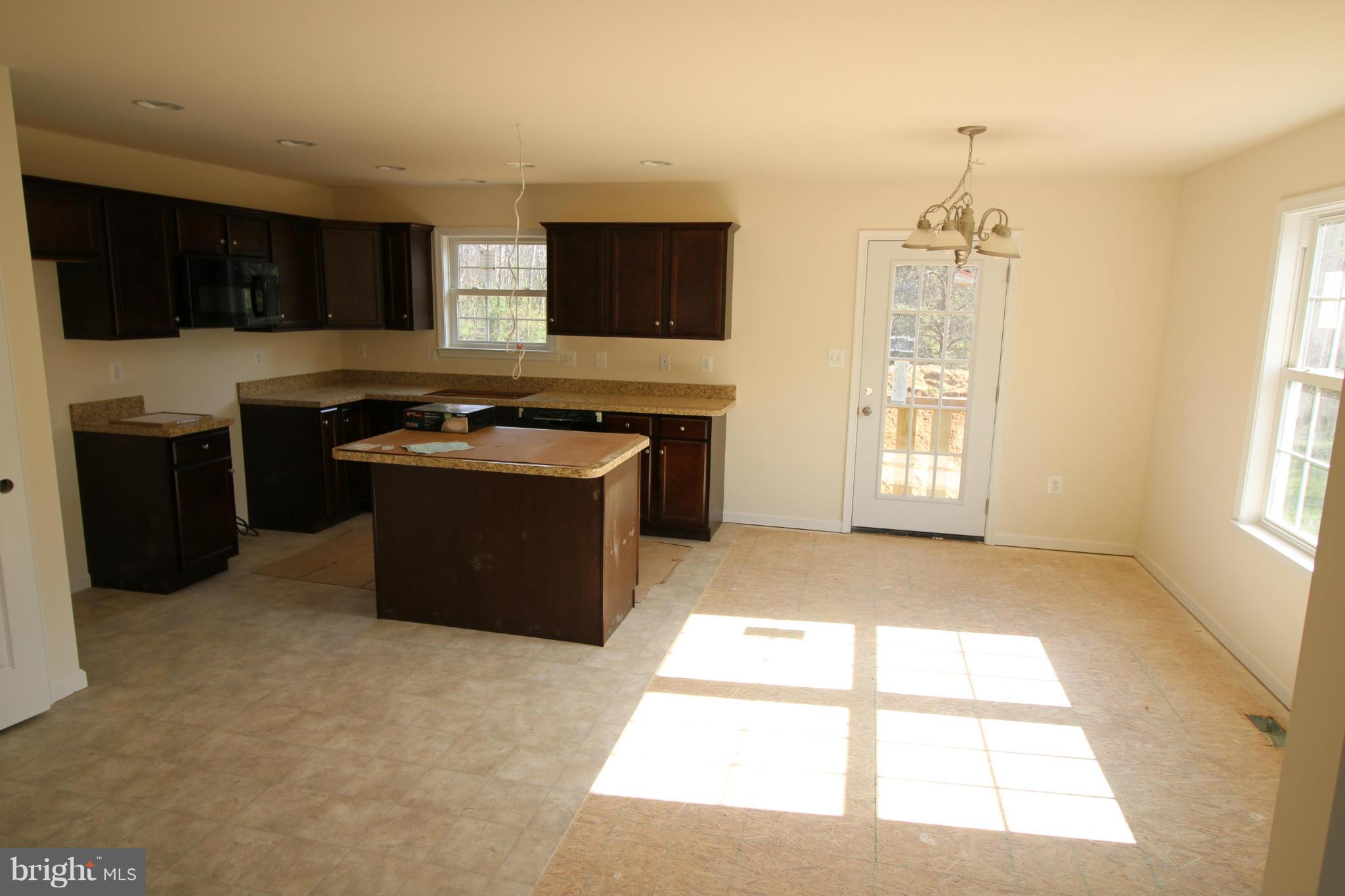 2710 Welltown Road Clear Brook, VA 22624 - Photo 4 of 6 a kitchen with a stove a sink and a window