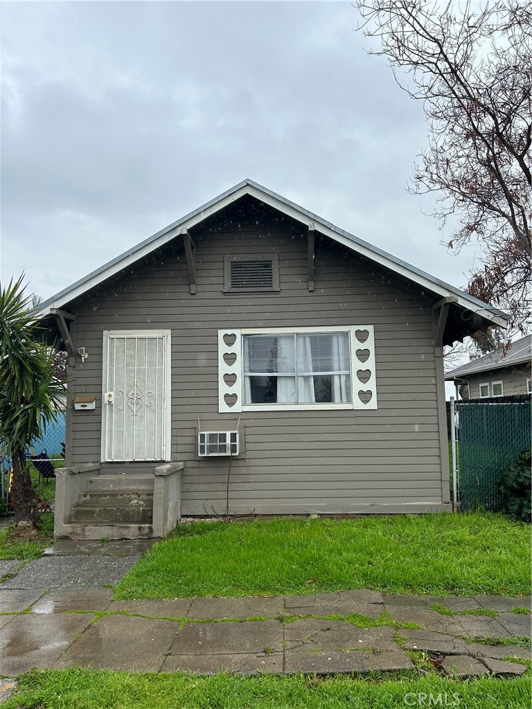 312 West Cedar Street Willows, CA 95988 - Photo 1 of 21 a front view of a house with a yard