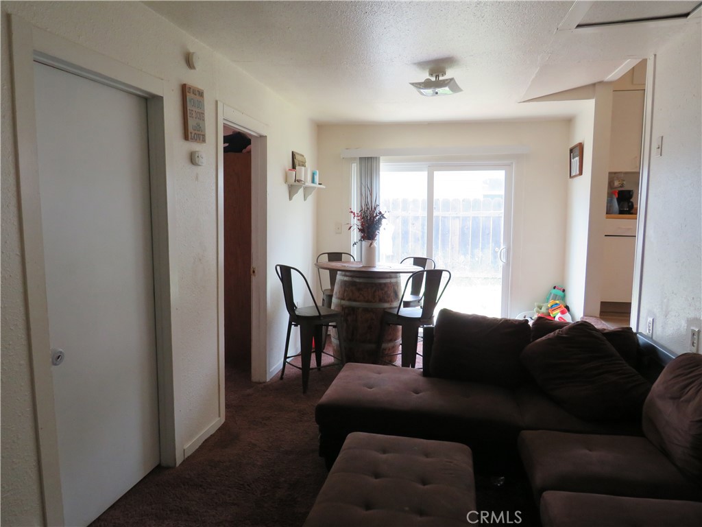 312 West Cedar Street Willows, CA 95988 - Photo 13 of 21 a living room with furniture and a window