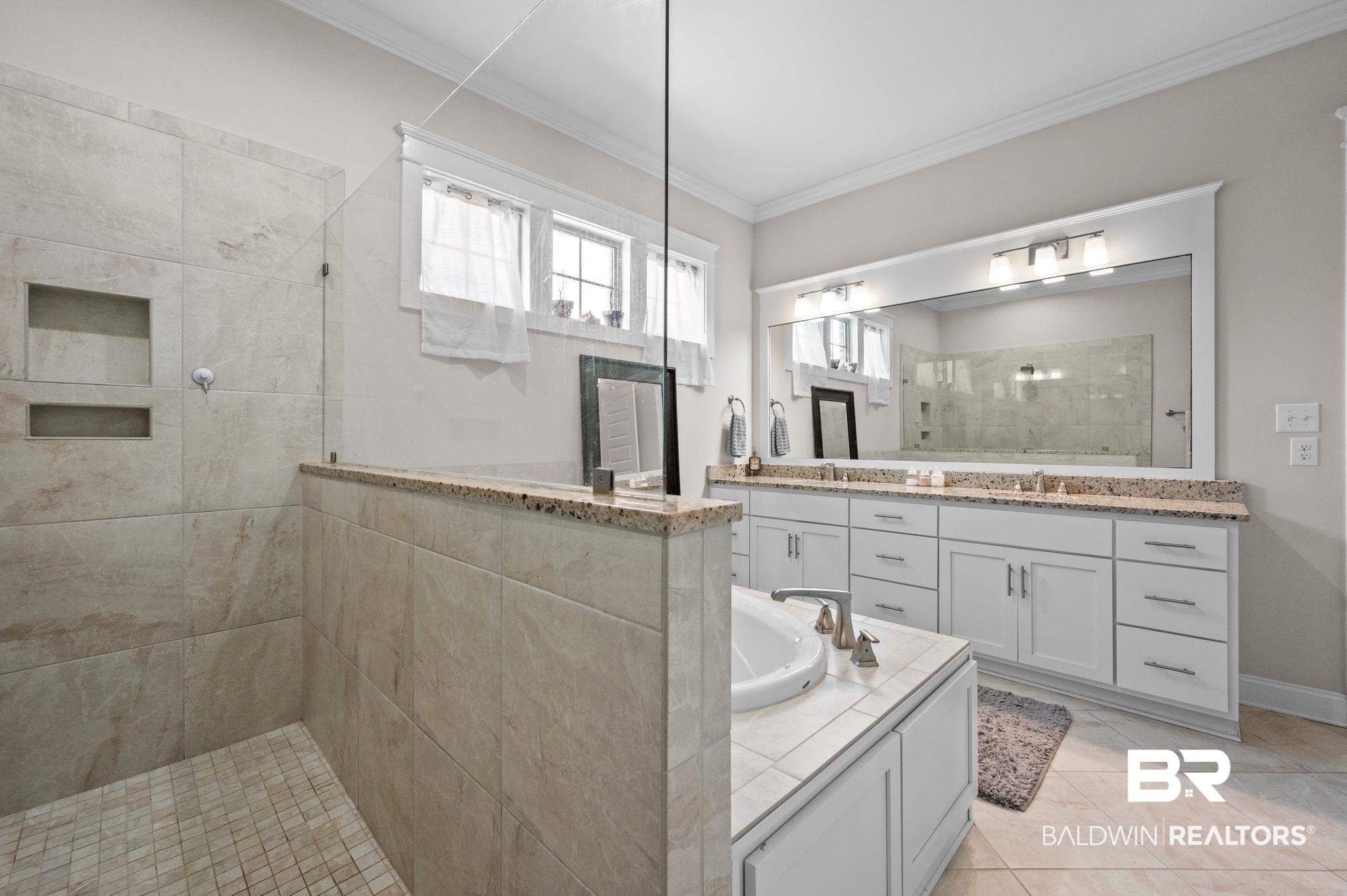 32194 Badger Court Daphne, AL 36527 - Photo 32 of 49 Bathroom featuring double vanity, ornamental molding, and walk in shower