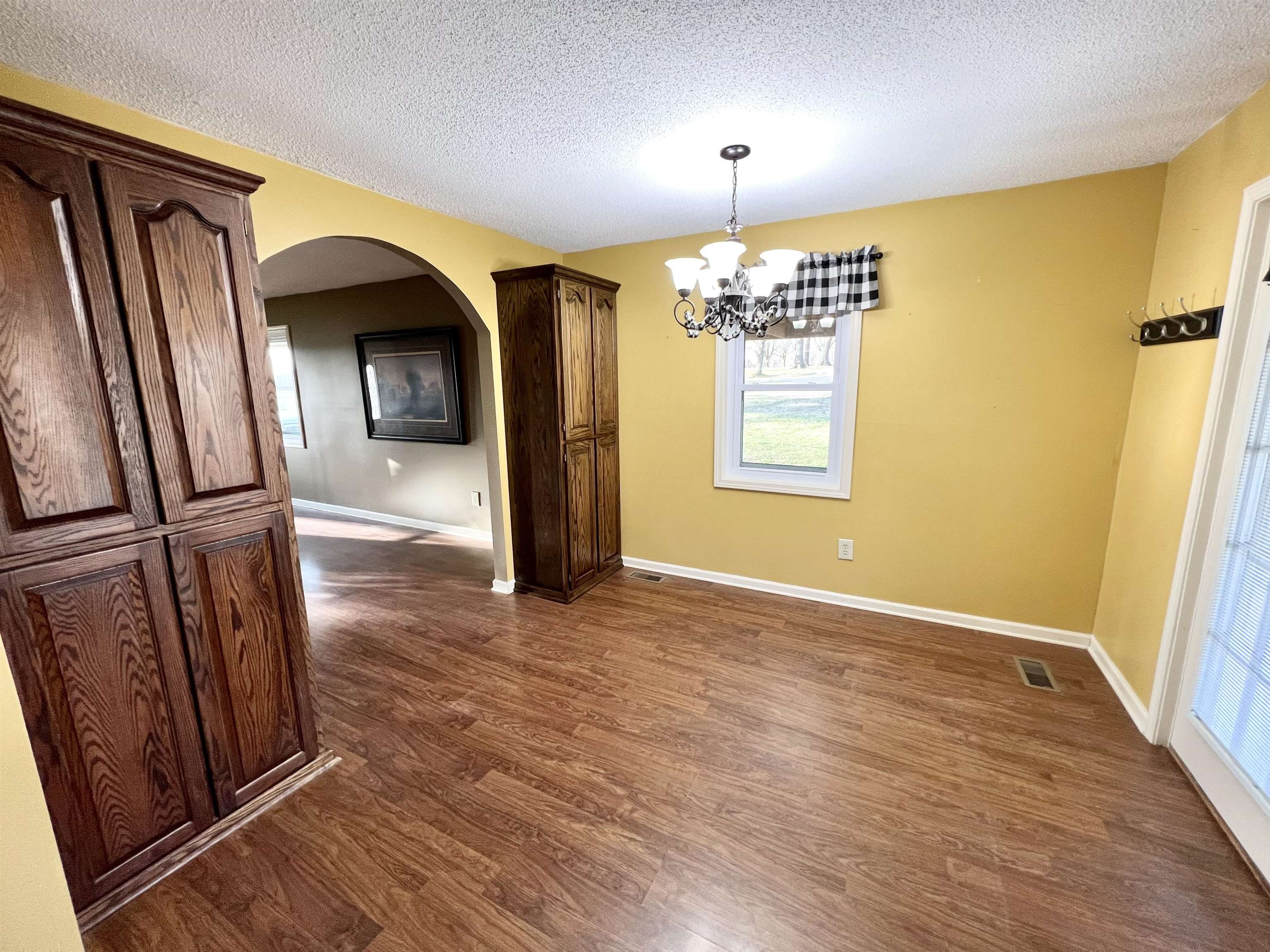 3982 Craig Road Ripley, TN 38063 - Photo 8 of 12 wooden floor in an empty room with a window