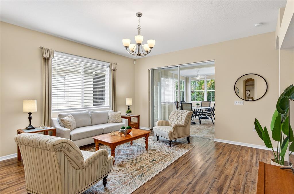 1737 Sassafras Drive Wesley Chapel, FL 33543 - Photo 16 of 58 a living room with couches a fireplace and a potted plant